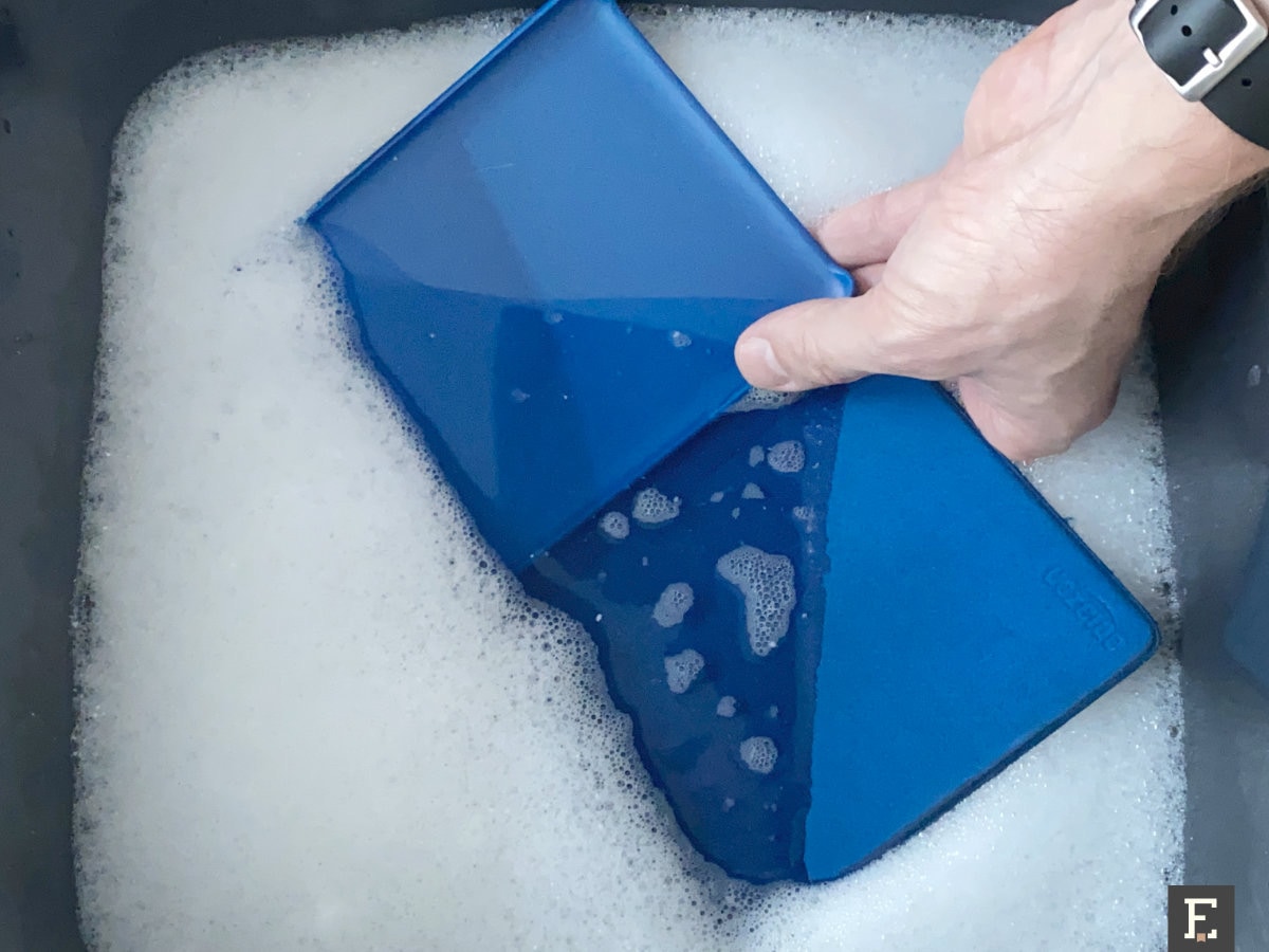 Clean old Kindle case with water and laundry detergent