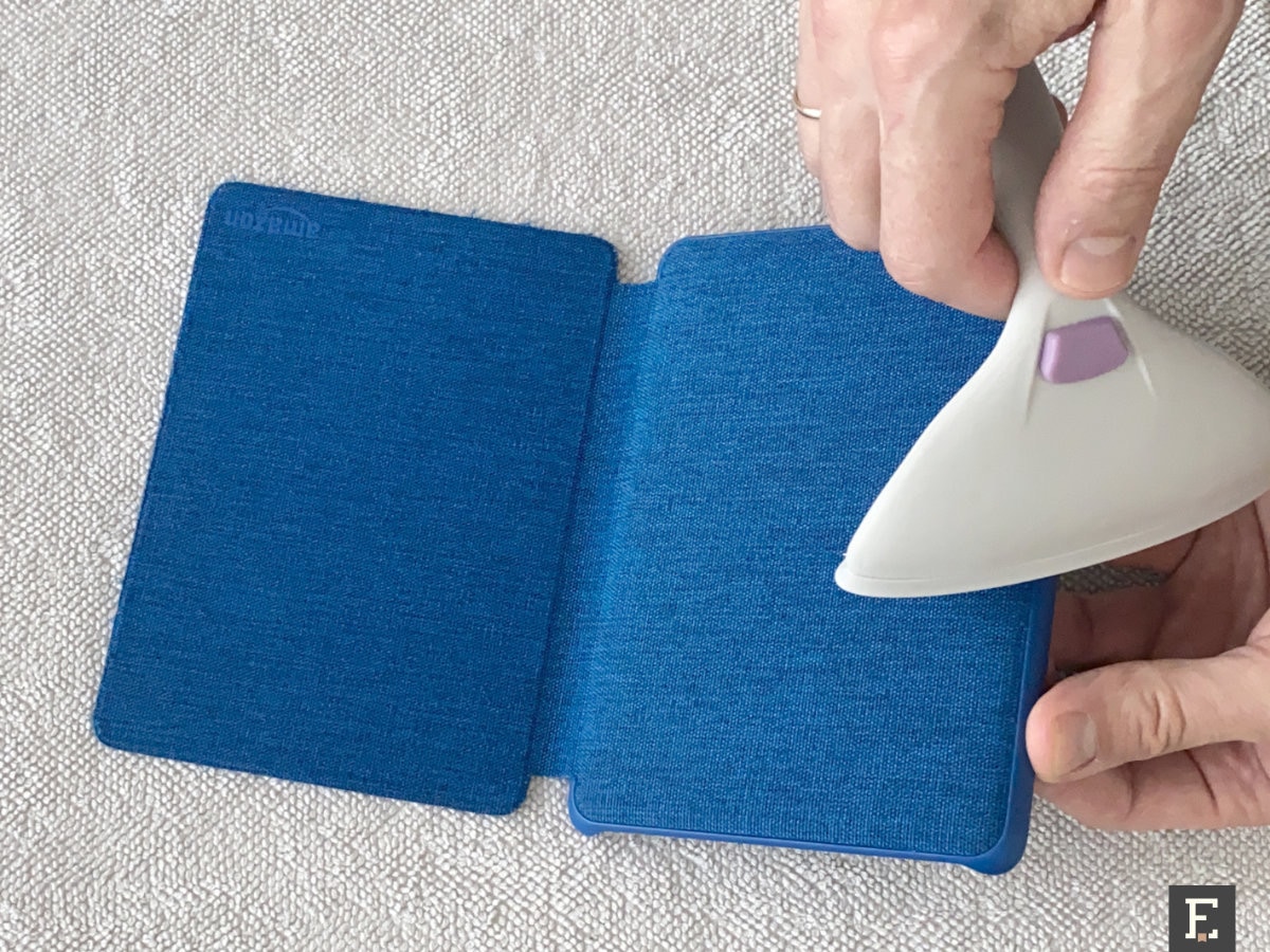 Use pet hair removal roller to clean fabric Kindle case